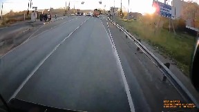 Dashcam captures terrifying moment truck rolls after running red light ...